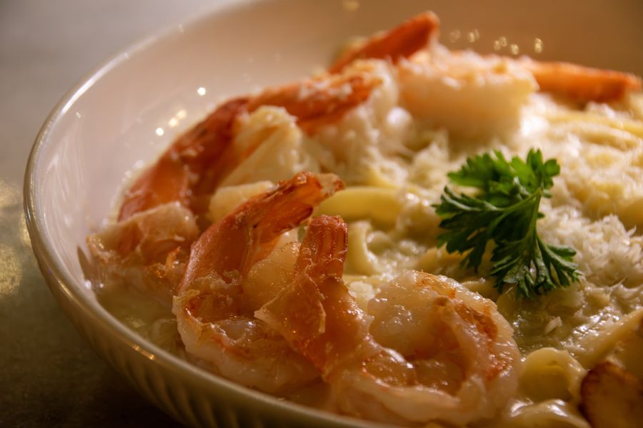Fettuccini and shrimp at Restaurante Bocas &mdash; pasta in a creamy garlic sauce topped with grilled shrimp, grated cheese and fresh parsley